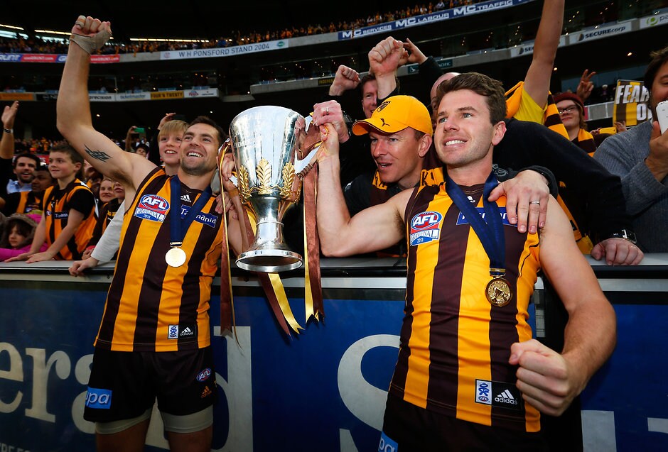 AFL 2013 Toyota Grand Final - Hawthorn v Fremantle Luke Hodge of the Hawks (left) and Jonathan Simpkin of the Hawks celebrate during the 2013 Toyota Grand Final match between the Hawthorn Hawks and the Fremantle Dockers at the MCG, Melbourne on September 28, 2013. (Photo: Michael Willson/AFL Media)